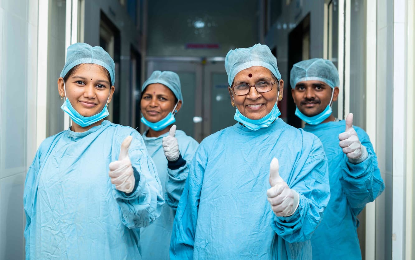 team of indian surgeons with thumbs up
