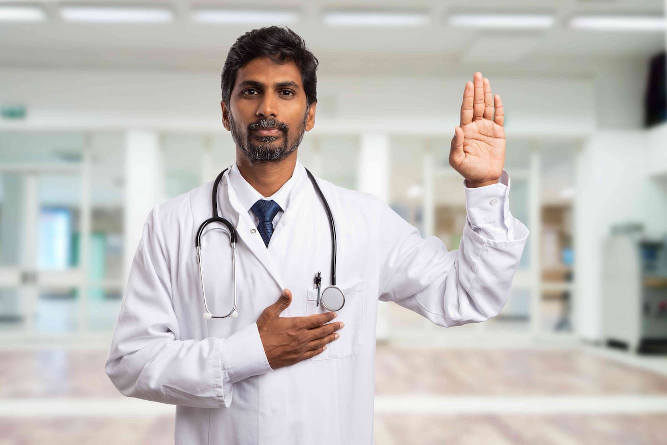 senior doctor with hand raised up