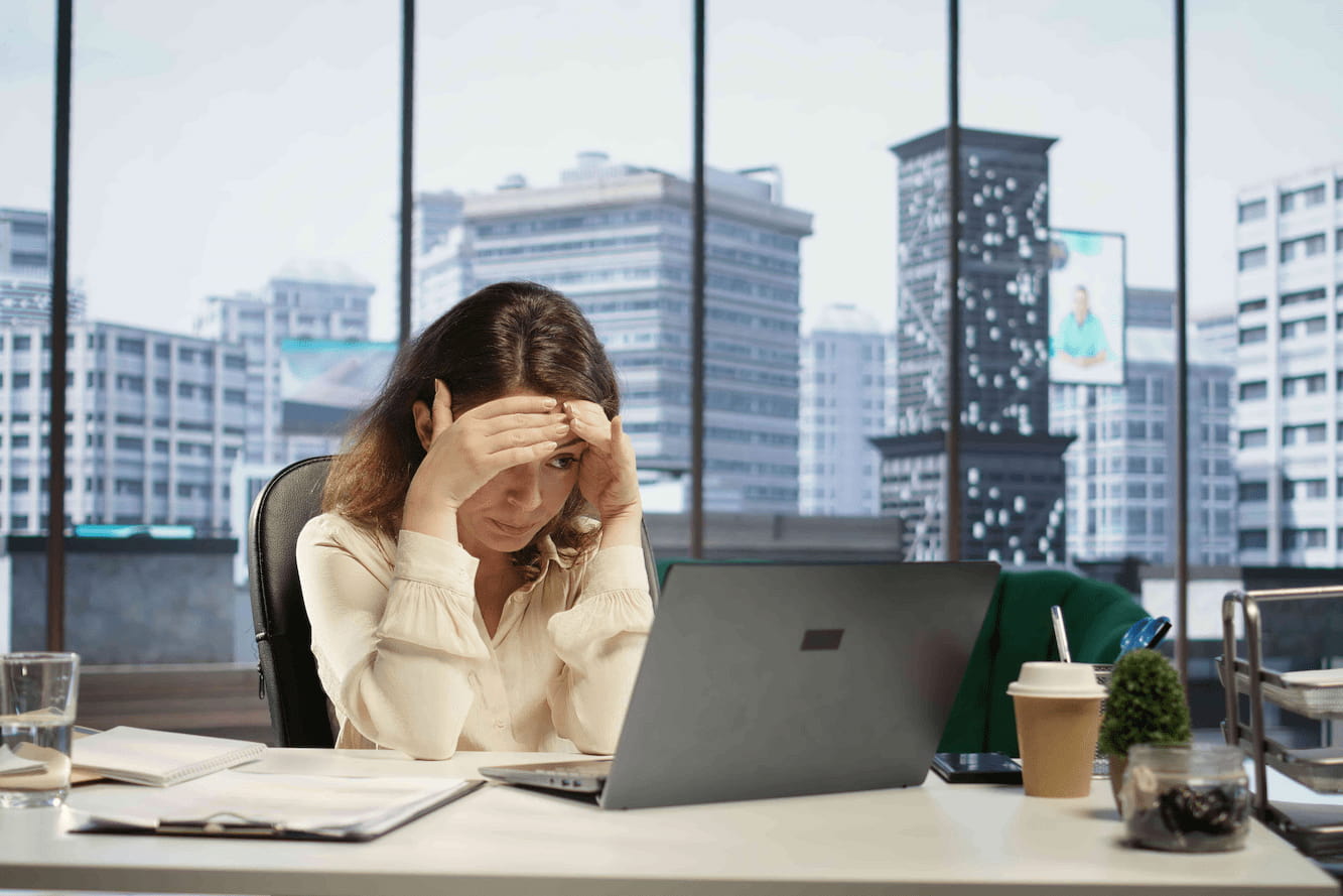 female CEO experiencing headache and pressure