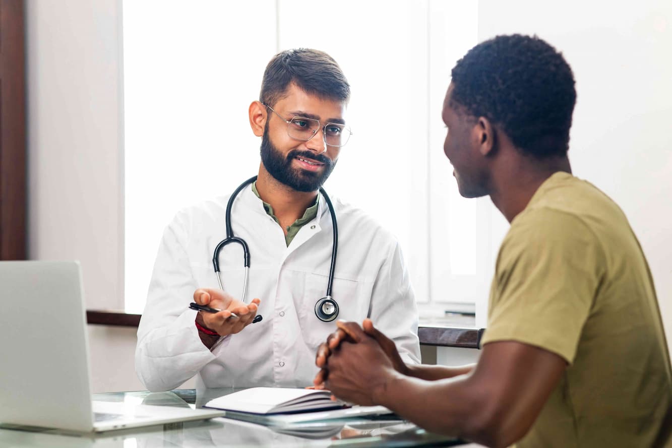 Indian doctor talking to international patient Medvoyage